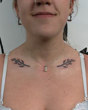 Get a unique illustrative design of olive branch done by Alien Ink with dotwork and hand-poke techniques.