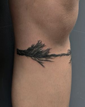 Get stunning illustrative rope tattoo by Alien Ink. Add a unique touch to your body art with this intricate design.