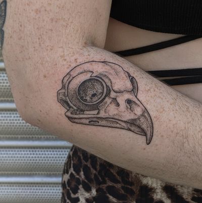 Unique dotwork and hand-poked design by Alien Ink, featuring a striking combination of bird and skull motifs.