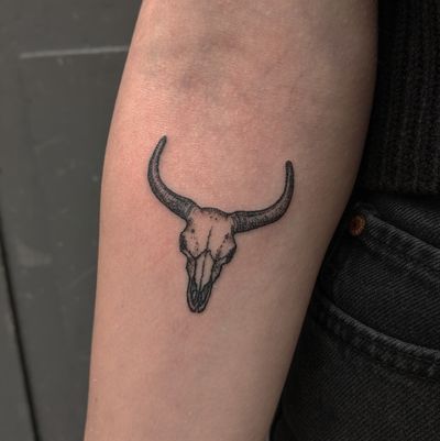 Get a striking blackwork tattoo of a cow skull design by Alien Ink. Perfect for those who love unique and edgy art.