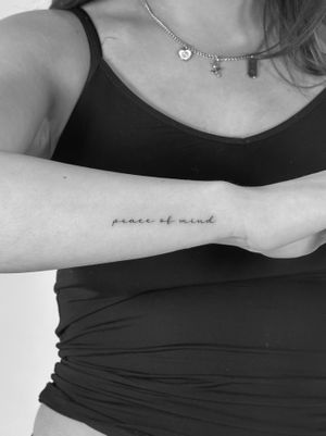 Get a stylish and delicate tattoo with small lettering by Saka Tattoo. Perfect for those who appreciate fine line work.