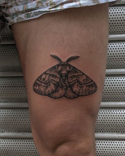 Discover the mystical allure of a hand-poked dotwork moth tattoo by Alien Ink. Timeless sophistication meets unique tattooing technique.