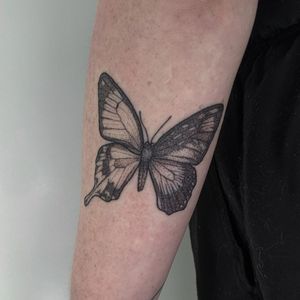 Discover the mesmerizing beauty of this blackwork and dotwork butterfly design by Alien Ink, created with precision and expertise.