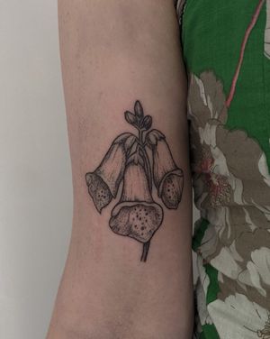 Hand-poked illustration of a delicate bellflower by Alien Ink, creating a unique and intricate tattoo design.