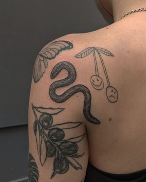 Unique illustrative design by Alien Ink, showcasing a detailed earthworm in dotwork style done by handpoke technique.