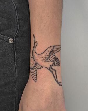 Elegant dotwork hand-poked crane tattoo design by the talented artist at Alien Ink. Perfect for nature lovers! 🦢