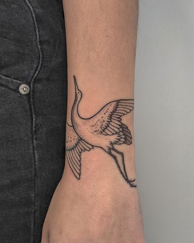 Elegant dotwork hand-poked crane tattoo design by the talented artist at Alien Ink. Perfect for nature lovers! 🦢