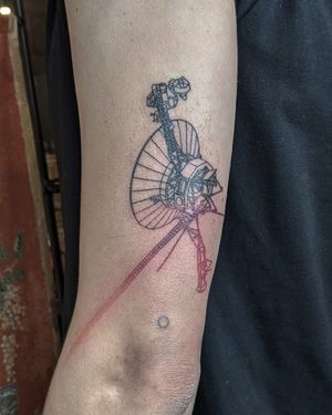 Explore the cosmos with this delicate fine line satellite tattoo done by Alien Ink. Perfect for astronomy enthusiasts!