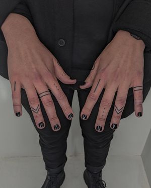 Discover the beauty of ornamental finger tattoos with this stunning design by Alien Ink. Perfect for those looking to make a statement.