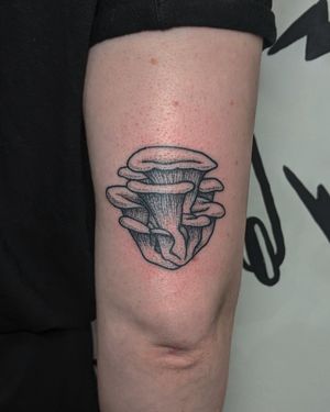 Get a one-of-a-kind mushroom tattoo in blackwork and dotwork styles, hand-poked by the talented artists at Alien Ink.