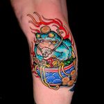 Experience the fusion of traditional Japanese art with modern neo-traditional style in this stunning lower leg tattoo by Jethro Wood.