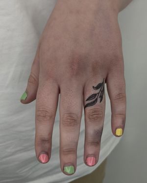 Experience a unique fusion of dotwork and illustrative styles with this hand-poked vine tattoo by Alien Ink.
