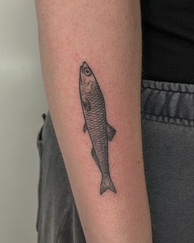Experience unique dotwork style with this stunning hand-poke fish tattoo designed by Alien Ink.