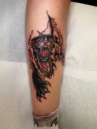 Get a fierce and classic traditional panther tattoo by the talented artist flashbyaj. Stand out with this bold and timeless design.