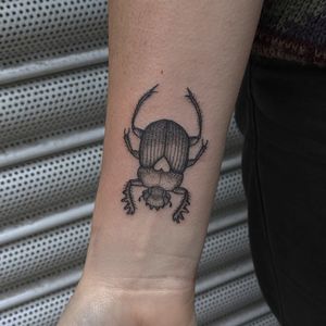 Unique hand-poked illustrative beetle design by Alien Ink, created with intricate dotwork technique.