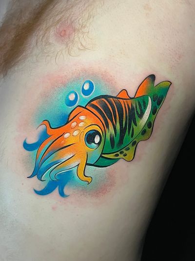 Adorable illustrative squid design with a kawaii twist by Cloto.tattoos. Perfect for those who love cute and unique tattoos!