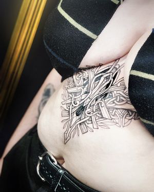 "This tattoo intricately weaves together Celtic and Viking elements, creating a neoviking masterpiece that resonates with ancient tales." 