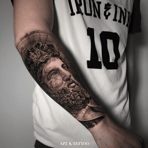 Zeus Portrait Tattoo in Black and Gray realism on Forearm by APZ in Copenhagen, Denmark. In Copenhagen, APZ, a world-class tattoo artist, crafts modern black and gray realism tattoos. His Zeus piece on a forearm speaks volumes with its lifelike realistic details. APZ’s talent travels from Copenhagen to New York to Dubai, leaving impactful, soulful marks wherever he goes. Want to get a unique reminder? APZ is here to help you. Explore his portfolio on Instagram: @apztattoo. #surrealism #Realism #black&gray #tattoodoambassador #blackandgray #realism #surrealism #Black & Gray