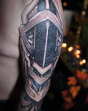 "This Celtic-infused tattoo weaves a tale of ancient artistry, merging with Viking symbolism in a striking visual narrative."
