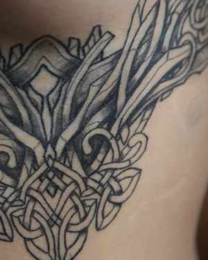 "Delve into the intricacies of Celtic and Viking symbolism in this neoviking tattoo, where ancient stories unfold in modern ink."

