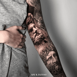 Hades and Hercules Tattoo in Black and Gray realism on Arm by APZ in Copenhagen, Denmark.In Copenhagen, APZ, a world-class tattoo artist, crafts modern black and gray realism tattoos. His Hades and Hercules piece on a arm speaks volumes with its lifelike realistic details. APZ’s talent travels from Copenhagen to New York to Dubai, leaving impactful, soulful marks wherever he goes. Want to get a unique reminder?  APZ is here to help you.  Explore his portfolio on Instagram: @apztattoo.#surrealism #Realism #black&gray #tattoodoambassador #blackandgray #realism #surrealism #Black & Gray