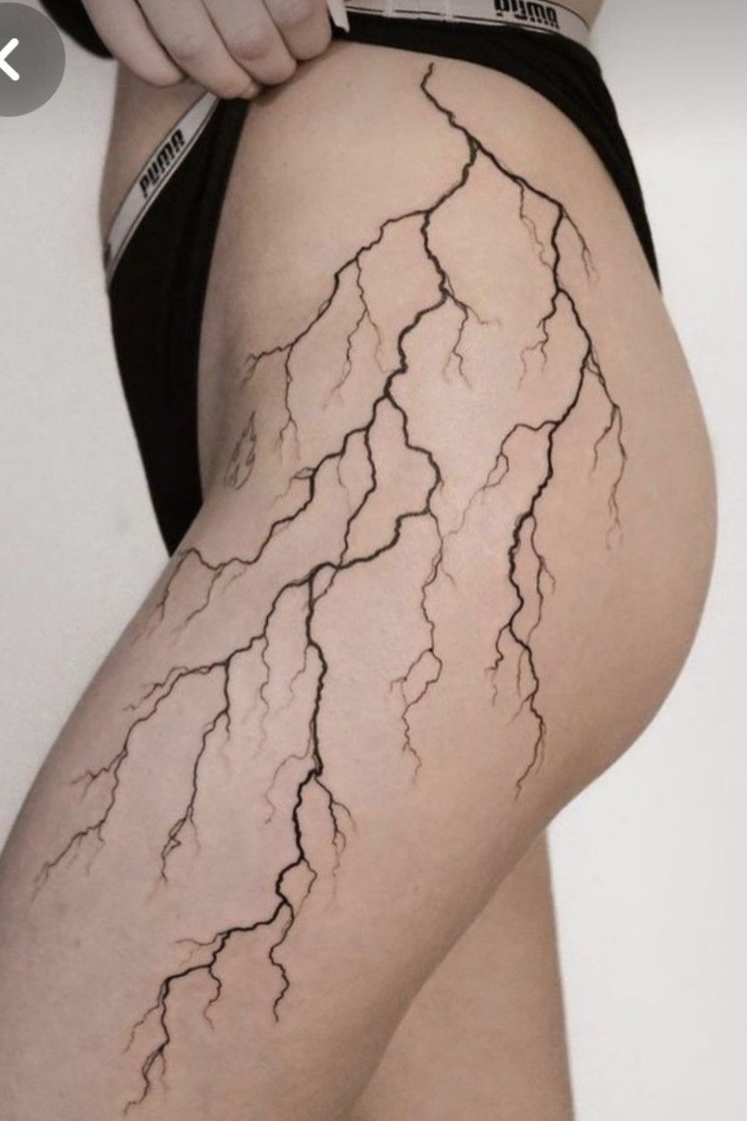 Illustrative heron tattoo on the left leg, hip and