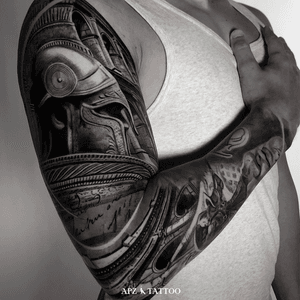 Tattoo of a Roman soldier in black and gray realism on the arm, by the tattoo artist APZ in Copenhagen, Denmark.In Copenhagen, APZ, a world-class tattoo artist, crafts modern black and gray realism tattoos. His Roman soldier piece on an arm speaks volumes with its lifelike realistic details. APZ’s talent travels from Copenhagen to New York to Dubai, leaving impactful, soulful marks wherever he goes. Want to get a unique reminder?  APZ is here to help you.  Explore his portfolio on Instagram: @apztattoo.#surrealism #Realism #black&gray #tattoodoambassador #blackandgray #realism #surrealism #Black & Gray