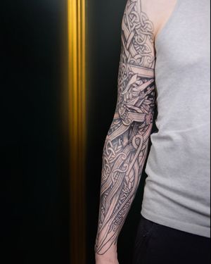 "Unveiling intricate Viking-inspired ink, this tattoo seamlessly blends ancient Norse motifs with contemporary artistry."
