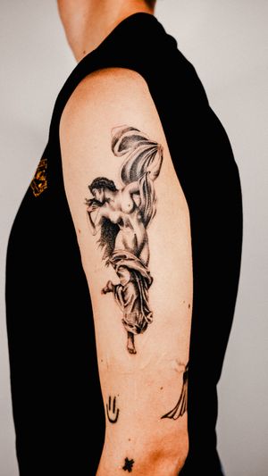 Discover the exquisite details of this black and gray dotwork tattoo depicting a beautiful statue woman by Gabriele Edu.
