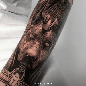 Tattoo of Anubis in black and gray realism on the forearm, by APZ in Copenhagen, Denmark.In Copenhagen, APZ, a world-class tattoo artist, crafts modern black and gray realism tattoo. His Anubis piece on the forearm speaks volumes with its lifelike realistic details. APZ’s talent travels from Copenhagen to New York to Dubai, leaving impactful, soulful marks wherever he goes. Want to get a unique reminder?  APZ is here to help you.  Explore his portfolio on Instagram: @apztattoo.#surrealism #realism #black&gray #tattoodoambassador #blackandgray #realism #surrealism #microrealism