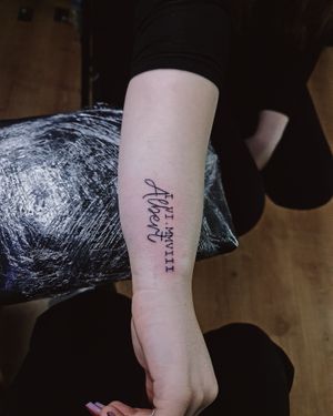 Get inked with delicate small lettering by Larisa Andreea Boboc, for a sophisticated and timeless tattoo design.