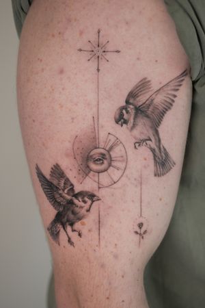 Experience the detailed beauty of a black and gray fine line tattoo featuring a geometric bird and eye, created by the talented artist Alexander Rufio.