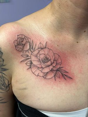 First half of clients chest fine line floral rose design