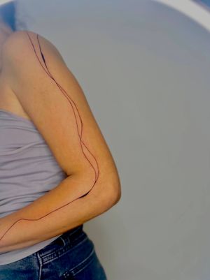 abstract hand drawn line tattoo