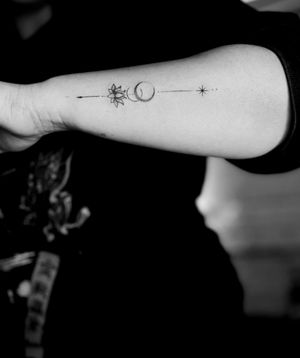 custom moon and lotus flower fine line tattoo
