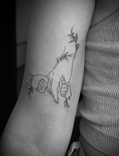 Celebrate family bond with this illustrative fine line tattoo featuring hands by talented artist Ruth Hall.