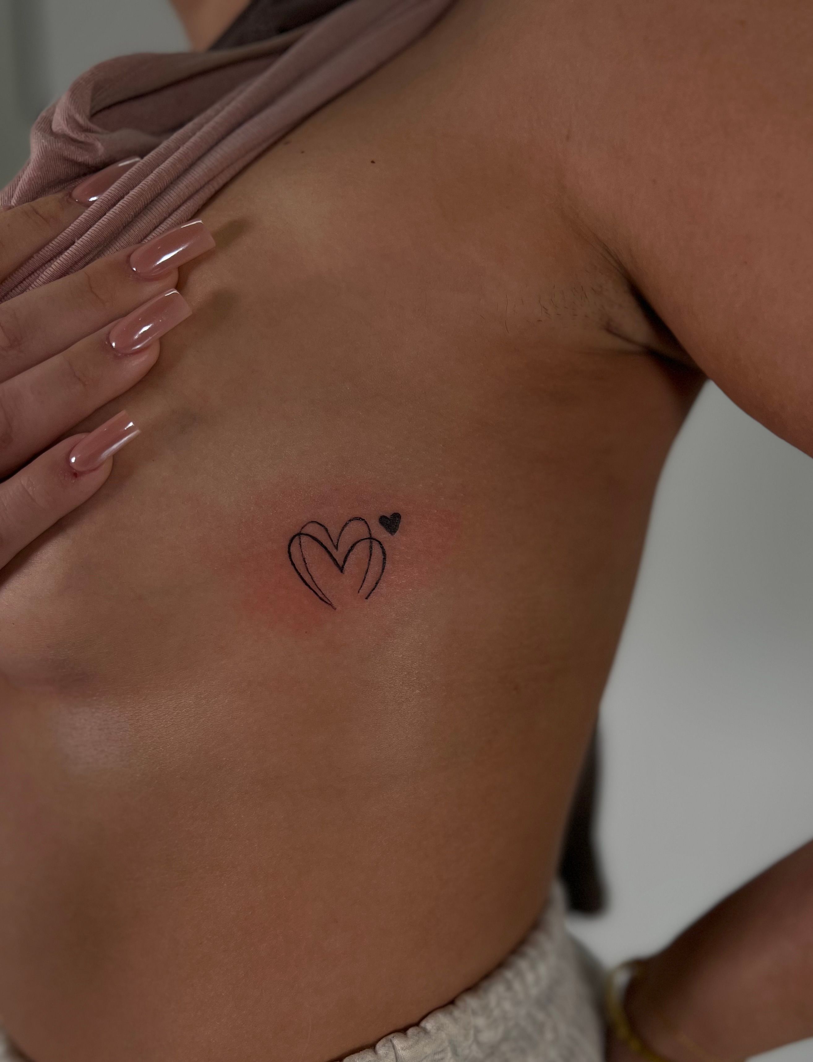 Little heart tattoos on neck 😌 Artist: @eyekonic_ink #smalltattoo  #tattooink #tinytattoo #tattooist #tattooinkspiration #tattoodesign… |  Instagram