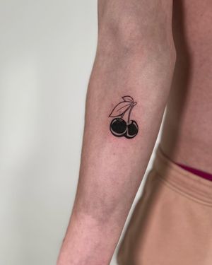 Experience the intricate beauty of illustrative blackwork with this stunning cherry tattoo by artist Faith Llewellyn.