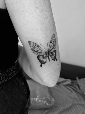 Get inked with this stunning illustrative butterfly tattoo by talented artist Ruth Hall. Embrace the beauty of nature with this elegant design.