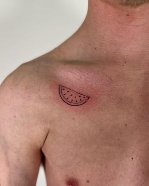Get a slice of summer with this fine line watermelon tattoo by Faith Llewellyn. Simple yet eye-catching design.