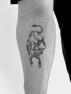 Capture the power and grace of the bull with this stunning black and gray illustrative tattoo by Saka Tattoo.