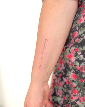 Get a delicate and subtle small lettering tattoo by Bradley Mollett, perfect for a minimalist aesthetic.