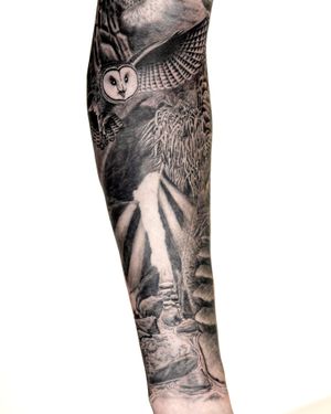 Capture the beauty of nature with this stunning black and gray tattoo by Bradley Mollett. Featuring a majestic owl perched near a tranquil waterfall.