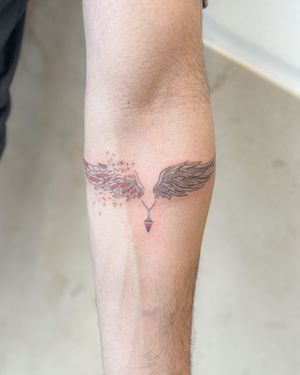 Embrace your freedom with this illustrative wing tattoo, expertly crafted by Bradley Mollett. Delicate and intricate, this design is a symbol of grace and spirituality.