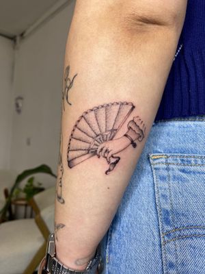 Get a stunning illustrative fan design on your hand by the talented artist Charlie Macarthur.