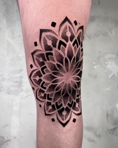 Discover stunning geometric mandalas in dotwork style expertly crafted by tattoo artist Andrew Garinther.