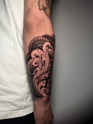 This abstract illustrative tattoo by Avi features a unique and artistic design that will stand out on your skin.