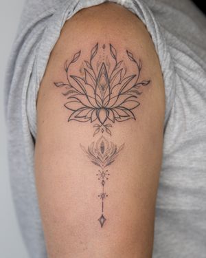 Experience the beauty of ornamental dotwork in this illustrative lotus tattoo by the talented artist Bradley Mollett.
