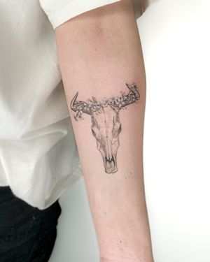 Stunning illustrative design by Bradley Mollett featuring a cow skull and ox motif in black & gray tones.