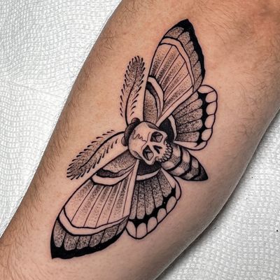 Unique blackwork moth design with intricate dotwork details, done by the talented artist Andrew Garinther.
